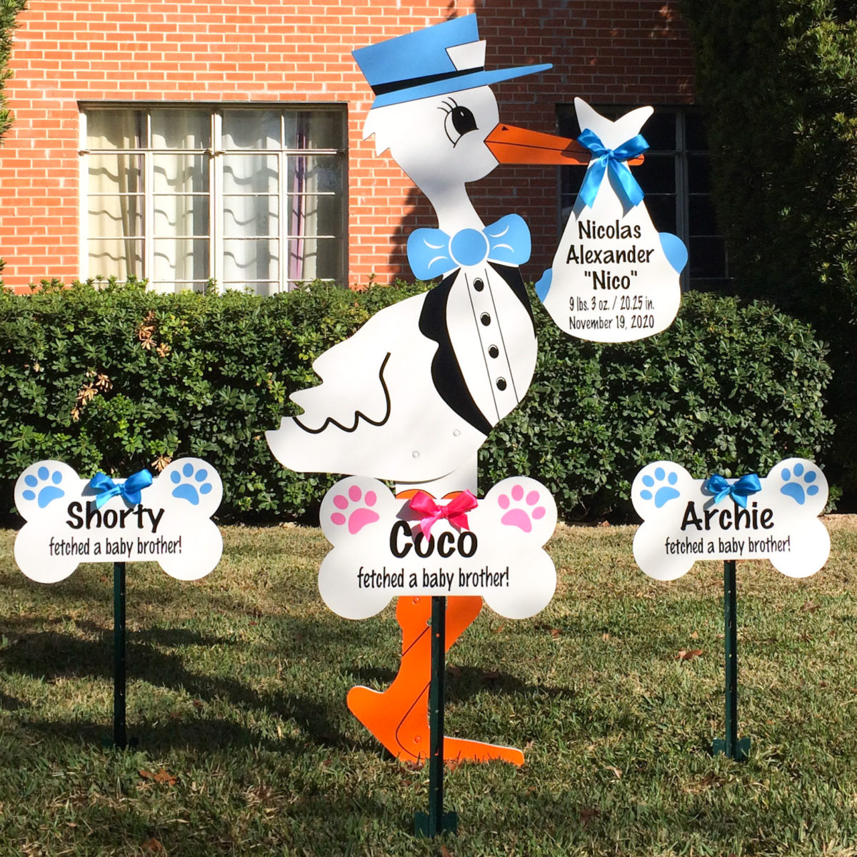 Blue Stork Signs with Dog Bone Signs - Stork Yard Sign Rentals - Louisville metro, Kansas